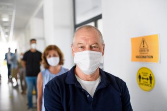 Portrait,Of,People,With,Face,Masks,Waiting,,Coronavirus,,Covid-19,And